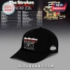 Black baseball cap with The Strokes The World Awaits 2026 tour design in red and white with band silhouette graphic!