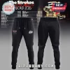 Black joggers with white and red The Strokes band logos on the front thighs for the World Tour 2026 concert merch!