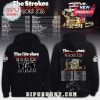 Black hoodie with The Strokes Reality Awaits The World 2026 text! Front has band graphic, back has tour dates and a truck!