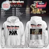 White The Strokes hoodie with 'Reality Awaits The World 2026' text! Features band silhouette, tour truck, and dates!