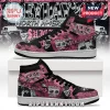 Pink and black high-top sneakers with a grunge collage design, skulls, and text reading $uicideboy$ and grey 59!