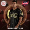A black and gold baseball jersey with 'Dodgers 00' in script text on the front and a Wu-Tang Clan logo on the sleeve!