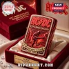 Red metallic AC/DC 53rd Anniversary lighter with embossed Angus Young, Sydney skyline, and 'FOR THOSE ABOUT TO ROCK 1973 - 2026' text!