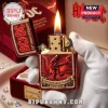 Red and gold rock band Zippo lighter with flame! AC/DC 53rd ANNIVERSARY FOR THOSE ABOUT TO ROCK 1973-2026! Retro lightning design!