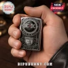 Silver metal lighter with AC DC High Voltage Back In Black text and bell shield graphic design!