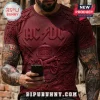 Dark red AC/DC band t-shirt with embossed graphic print of a cannon, bell, and chains in a 3D artistic style!
