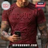 Dark red AC/DC band t-shirt with embossed bell, cannon, chain, and bolt graphic prints in a heavy metal rock style!