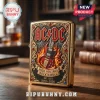 Gold lighter with AC DC logo, flaming guitar, scroll work, and text High Voltage Rock N Roll, 1973-2026 on black background!