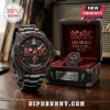 Black AC/DC vintage-style watch with red lightning bolt logo, red gem accents, black metal band, and 