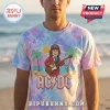 Tie-dye t-shirt featuring AC/DC logo and cartoon guitarist graphic on a tropical beach background!