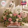 AKA swan plush centerpiece with pink and white roses, ivy leaves, and text reading AKA 1908 and By Culture and By Merit!