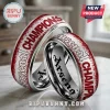 Silver rings with red splatter detail and Arsenal Champions text in bold block lettering!