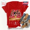 Red v-neck Arsenal football t-shirt featuring 2025-2026 player graphics, signatures, and gold Champions text!
