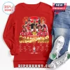 Red long sleeve Arsenal FC graphic tee featuring squad photos, gold Champions text, and player signatures for 2025-2026 season!