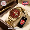 Gold stainless steel Arsenal FC commemorative watch with red dial, crest, and text Arsenal Football Club 1886-2026!