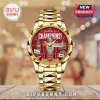Gold tone Arsenal FC Champions watch, red face, Big Ben, trophy graphic, 'ARSENAL FC CHAMPIONS!' '25/26 SEASON' text!