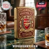 Gold Arsenal FC lighter with deep red ornate filigree and crest text reading Arsenal FC The Gunners Premier League Champions!