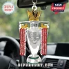 Silver Arsenal Premier League trophy car ornament with gold crown and red ribbons hanging from a rearview mirror!