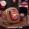Gold championship style ring with a large faceted red gemstone, featuring the Arsenal F.C. crest, and text ARSENAL F.C. THE GUNNERS EST. 1886!