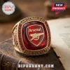 Gold Arsenal F.C. championship ring with large red faceted gem, shield logo, gold cannon, and