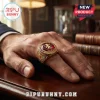 Gold championship ring with red stone featuring Aston Villa lion crest and 2026 Europa League text on a man's finger!