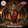 Bat shaped Bacardi Anejo Cuatro rum bottle with amber liquid and circular label on a wooden surface!