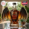 Bacardi Anejo Cuatro rum bottle shaped like a bat with wings amber glass liquid logo text on marble surface!