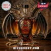 Bat shaped glass rum bottle with gold Bacardi logo label amber liquid and sugarcane on wooden background!
