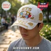 White distressed K-pop baseball cap with gold embroidered BTS, colorful BT21 characters, and 'COSMIC FRIENDS' text!