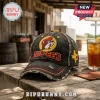 Distressed black denim baseball cap with Buc-ees beaver logo and Texas patch, featuring red and yellow embroidery details!