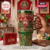Red and green Delta Sigma Theta Juneteenth tumbler with gold crest and raised metal details featuring fist and dove motifs!