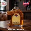 Gold glass liquor bottle shaped like an alligator head with 2025 NCAA National Champions label on a wooden table!