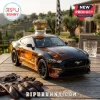 Amber glass Mustang car decanter with gold crown topper on wooden table with brown leather gloves!