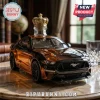 Black and amber Mustang car shaped liquor decanter with a gold crown stopper on a marble table!