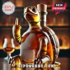 Amber glass liquor bottle shaped like a turtle flipping the middle finger on a wooden bar counter!