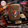 Antique gold Zippo lighter with Grateful Dead Stealie logo, dancing bears, roses, and Keep Truckin text in embossed metal!