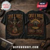 Black Guns N Roses 1985-2025 graphic t-shirt with skull, guitar, roses, and concert text on wooden background!