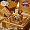 Gold Guns N' Roses 41st Anniversary lighter, engraved with revolvers, roses, text