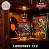 Iron Maiden The Number of the Beast 50th Anniversary glass bottle with crown topper on a wooden shelf near vinyl records!