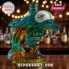 Teal glass dolphin liquor bottle with Miami Dolphins helmet logo and 60th anniversary text on a bar background!