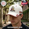 White baseball cap with Kappa Alpha Psi crest, embossed patterns, and red and gold ribbon details on side and brim!