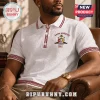 White polo shirt with Kappa Alpha Psi 1911 embroidery, maroon greek key trim, and textured fabric pattern!