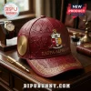 Burgundy faux leather Kappa Alpha Psi baseball cap with gold metallic greek symbols and crest on desk!
