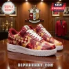 Custom sneakers with red and yellow tie-dye pattern, checkered swoosh, and Kappa Alpha Psi Greek letters on a wooden table!