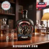 Black Crown Royal bottle featuring KISS band members graphic 50th anniversary text and flame designs on a wooden table!