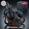 A close up photo of a Kraken rum bottle intricately wrapped in a detailed dark octopus sculpture with its gift box on a dark surface!