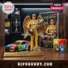 Kyle Busch collectible figure with gold wings holding trophy next to M and Ms Toyota Camry race car model!