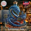A highly detailed blue dragon bottle intricately attacking a ship on a dark bar surface, labeled Leviathan Black Spiced Rum with a crown cap.