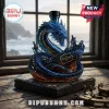 Blue glass dragon and ship rum bottle with The Leviathan Black Spiced Rum label on a wooden table near a window!