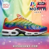 Rainbow sneaker with Pride text, hearts, smiley faces, and flower icons on a gradient pride flag background!